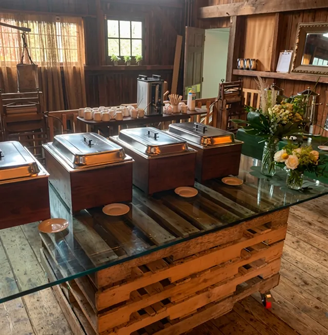 Rustic wooden bar set up for an event.
