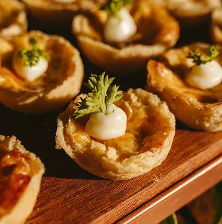 Bite-sized appetizers garnished with fresh herbs.