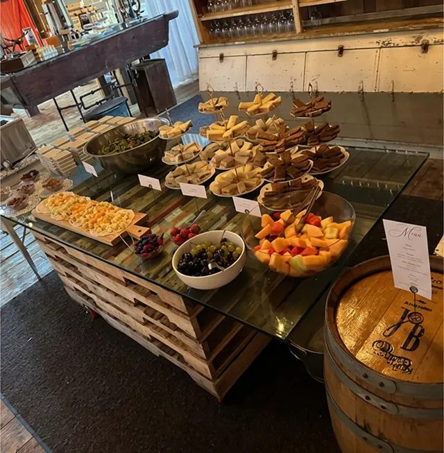 Assorted appetizers displayed on a rustic catering table.